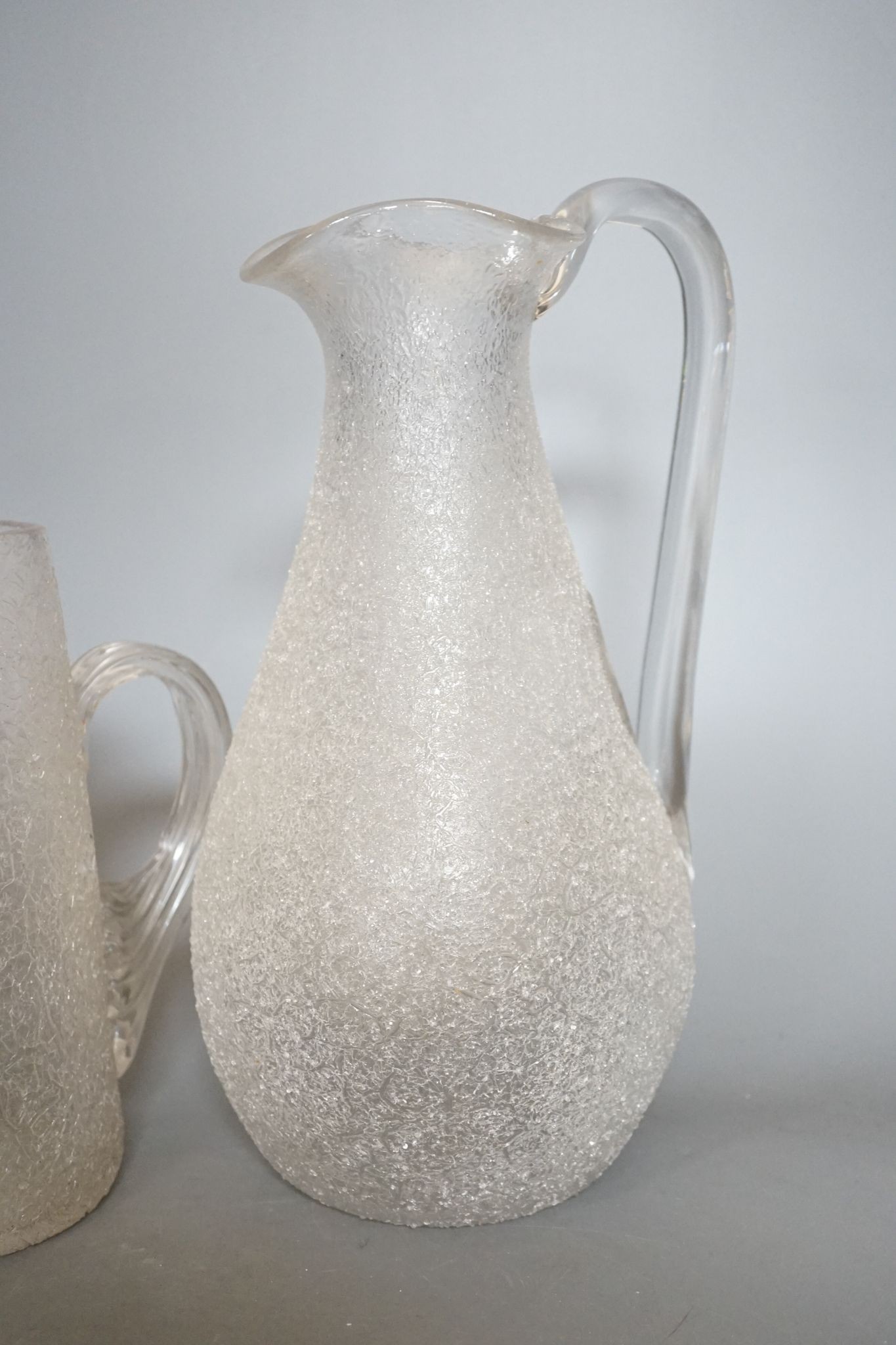 Five various Victorian iced glass jugs, 29cm